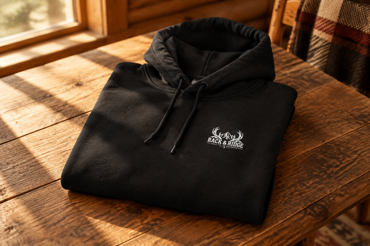 Black hoodie with a small logo on the chest 