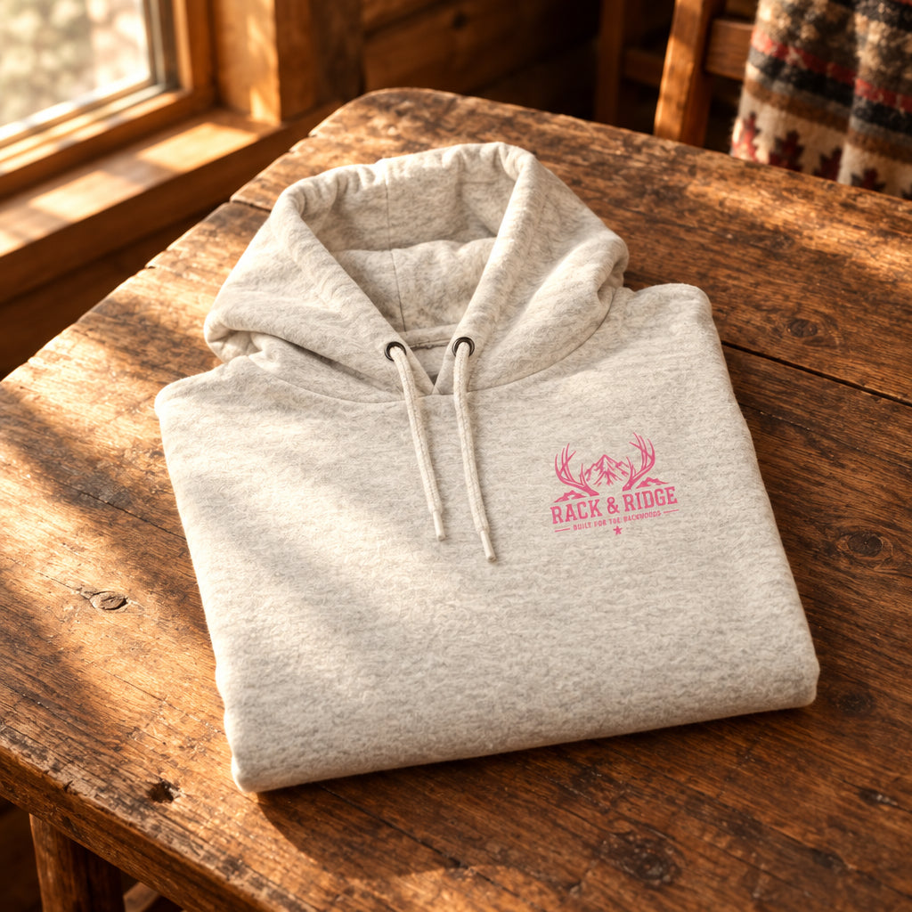 A light heather gray pullover hoodie with a small pink logo on the left chest.