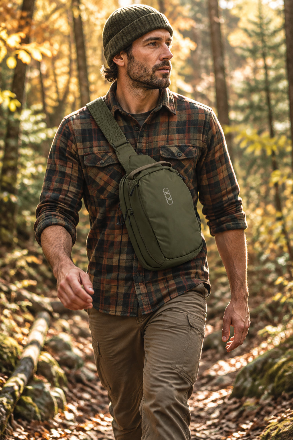 Green sling bag with a brand logo on a white background