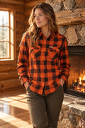 Orange and black plaid shirt on a white background