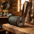 A spool of 200 feet of braided Harky Decoy Cord in a camouflage pattern of green, brown, and beige, wound on a black plastic spool.