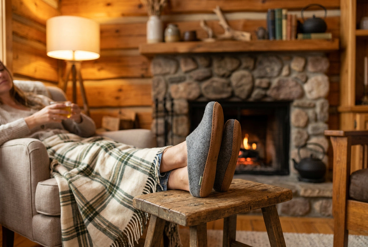 Pair of gray slippers with brown soles
